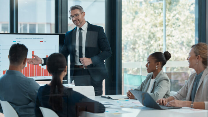 I Stock TEP business person presenting charts during presentation meeting
