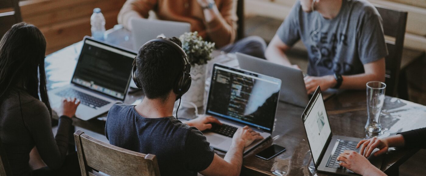 Group of people using laptop computers