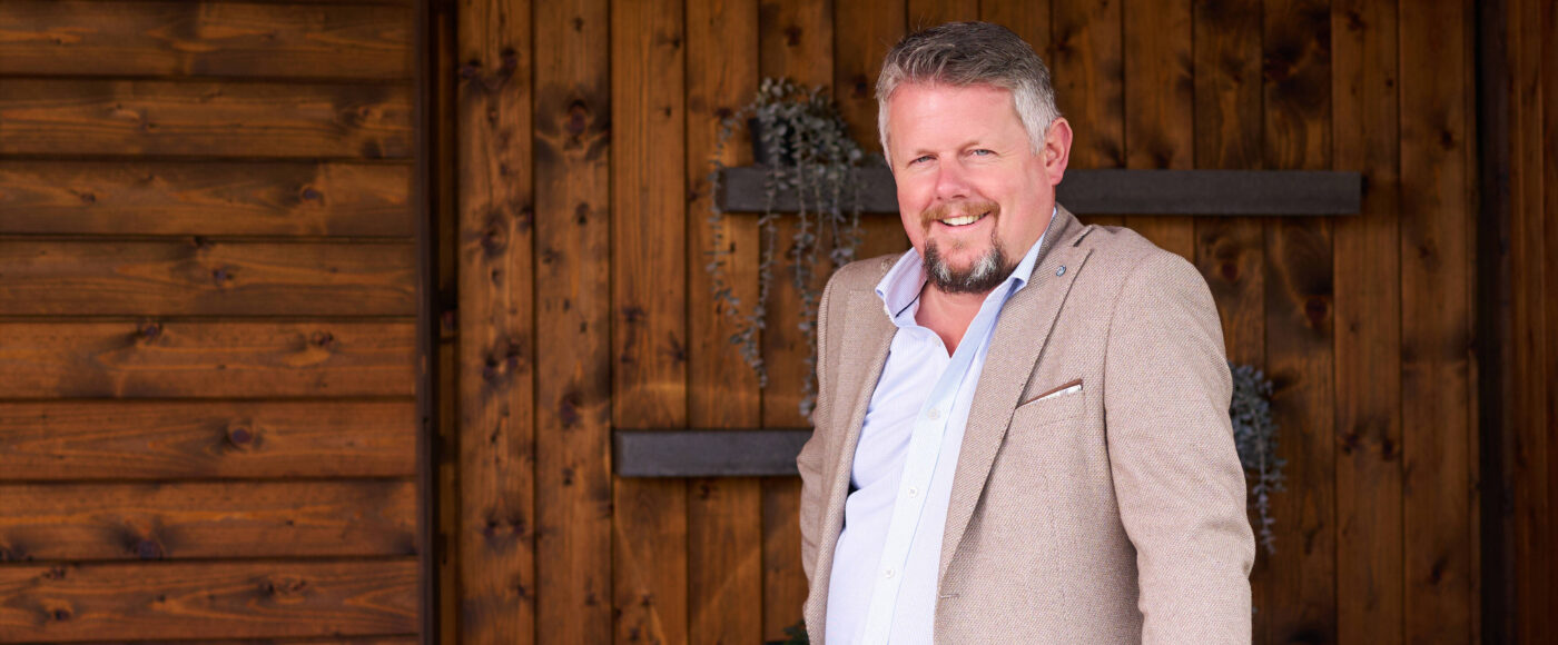 Jonathan Booth, CEO of Irish Stone, standing beside a stone surface.