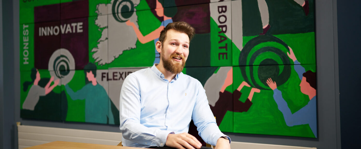 Stuart Watson, founder of Make a Melody, seated at a table in the company office.