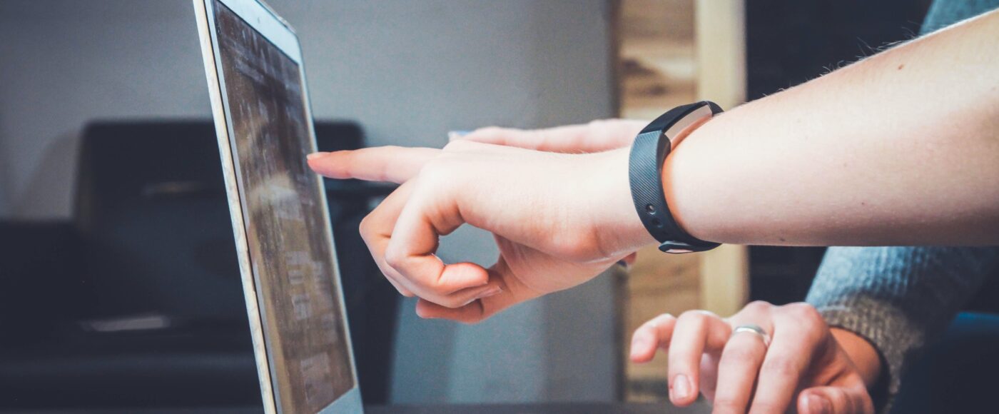 Man pointing to a laptop
