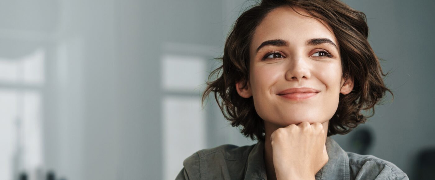 Professional seated in a workplace environment.