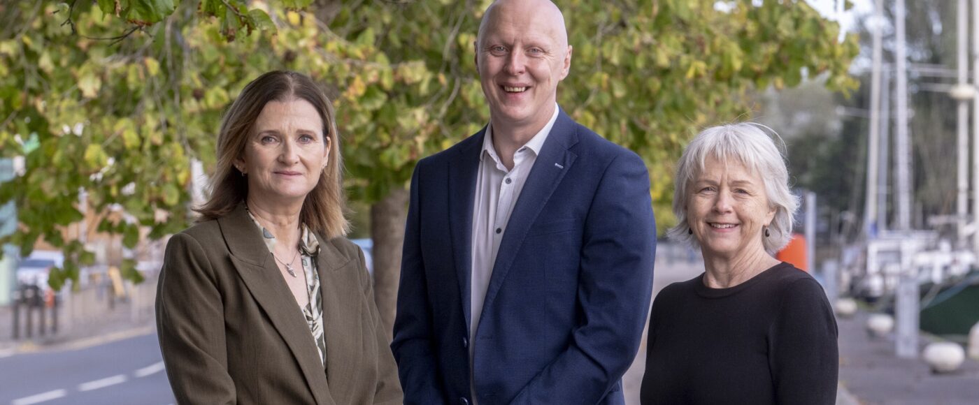 Paul Gunn, Anne Lanigan and Barbara Orr standing together outside The Alex hotel in Dublin during the launch of the Shared Island Sustainability Challenge Fund.
