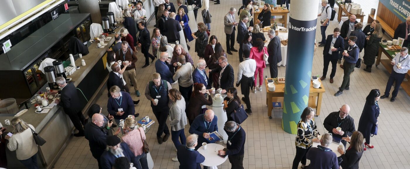 Attendees networking at the Trade Conference 2025 event.