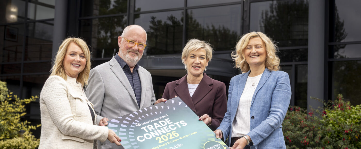 Leah McStravick, Neil O'Brien, Margaret Hearty and Suzanne Hill holding a Trade Connects 2026 sign outside InterTradeIreland headquarters.
