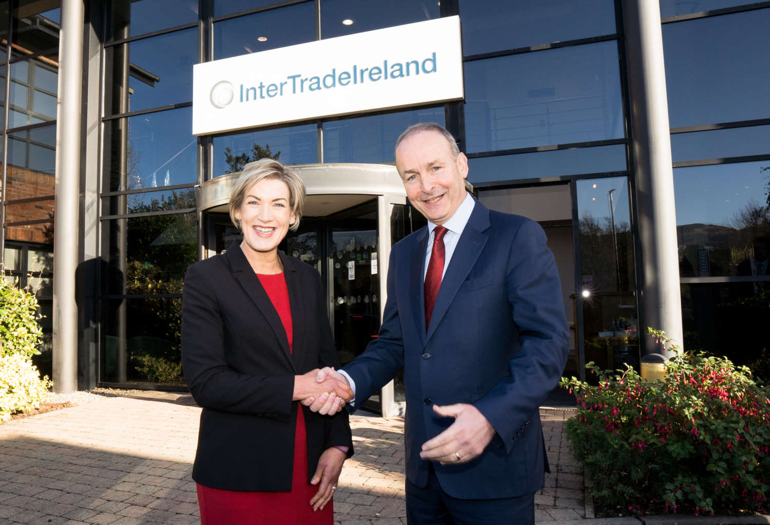 CEO Margaret Hearty shaking hands with Taoiseach Micheál Martin outside Inter Trade Ireland