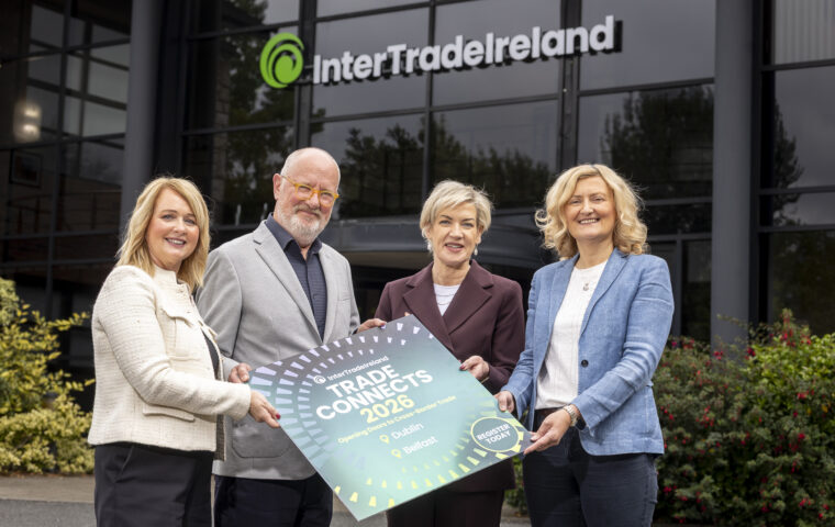 Leah McStravick, Neil O'Brien, Margaret Hearty and Suzanne Hill holding a Trade Connects 2026 sign outside InterTradeIreland headquarters.