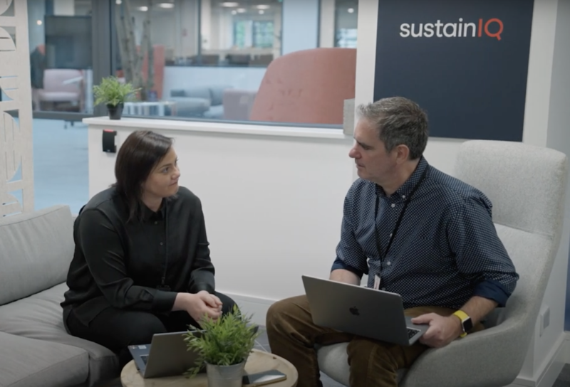 Liam and Maria sitting down talking at the Sustain IQ offices